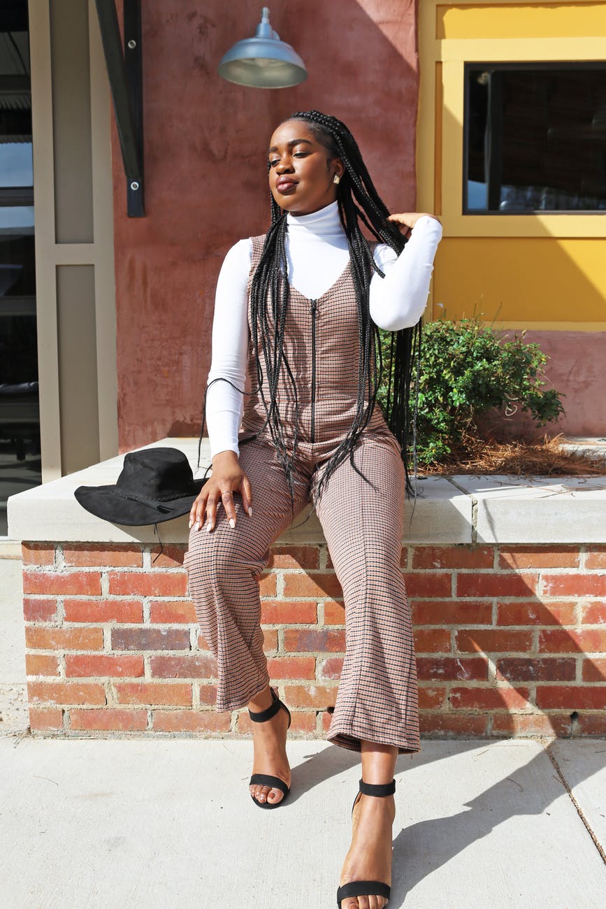 woman in white long sleeve shirt and overalls